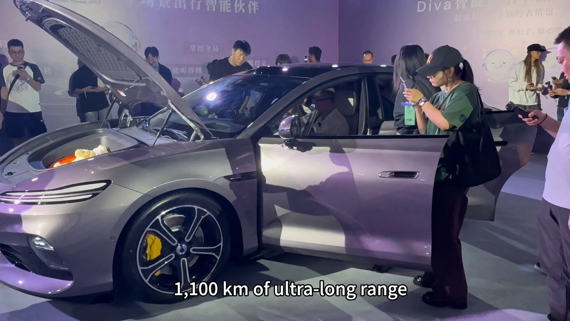 Denza Z9S front boot open on the launch-event stage, with fruit placed inside
