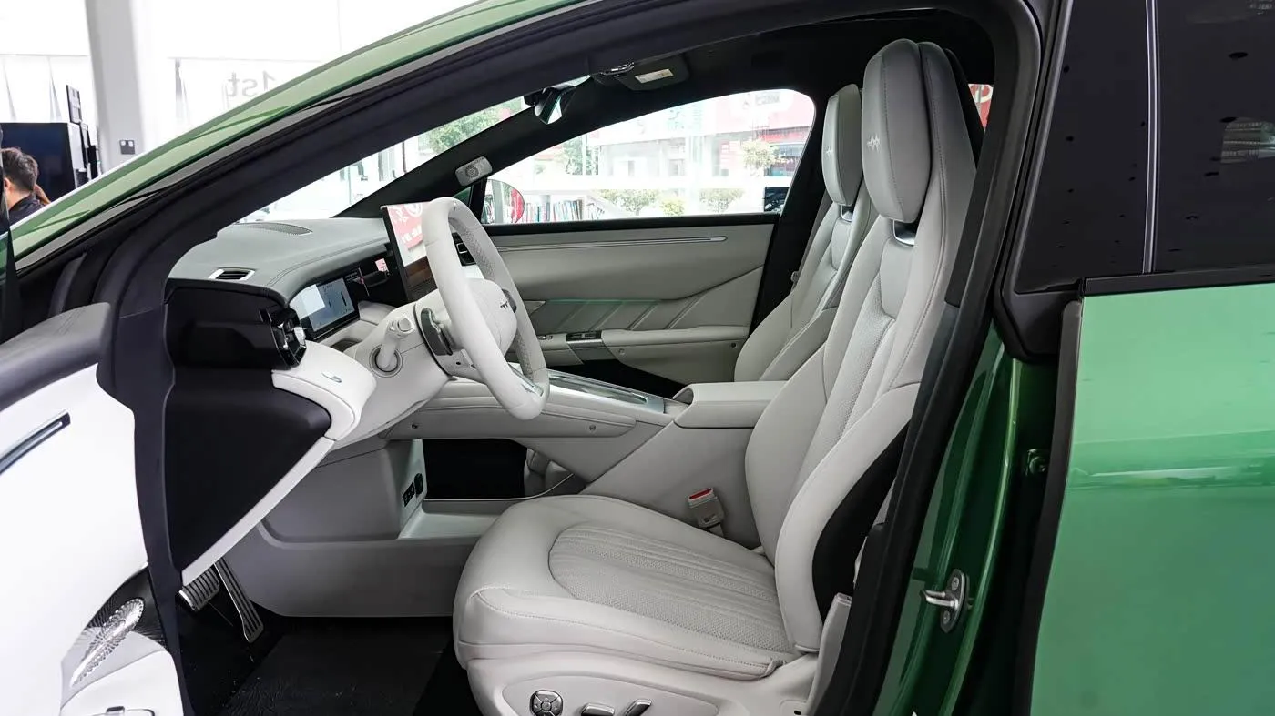 Fang Cheng Bao Formula S — front cabin through the open door (green car)