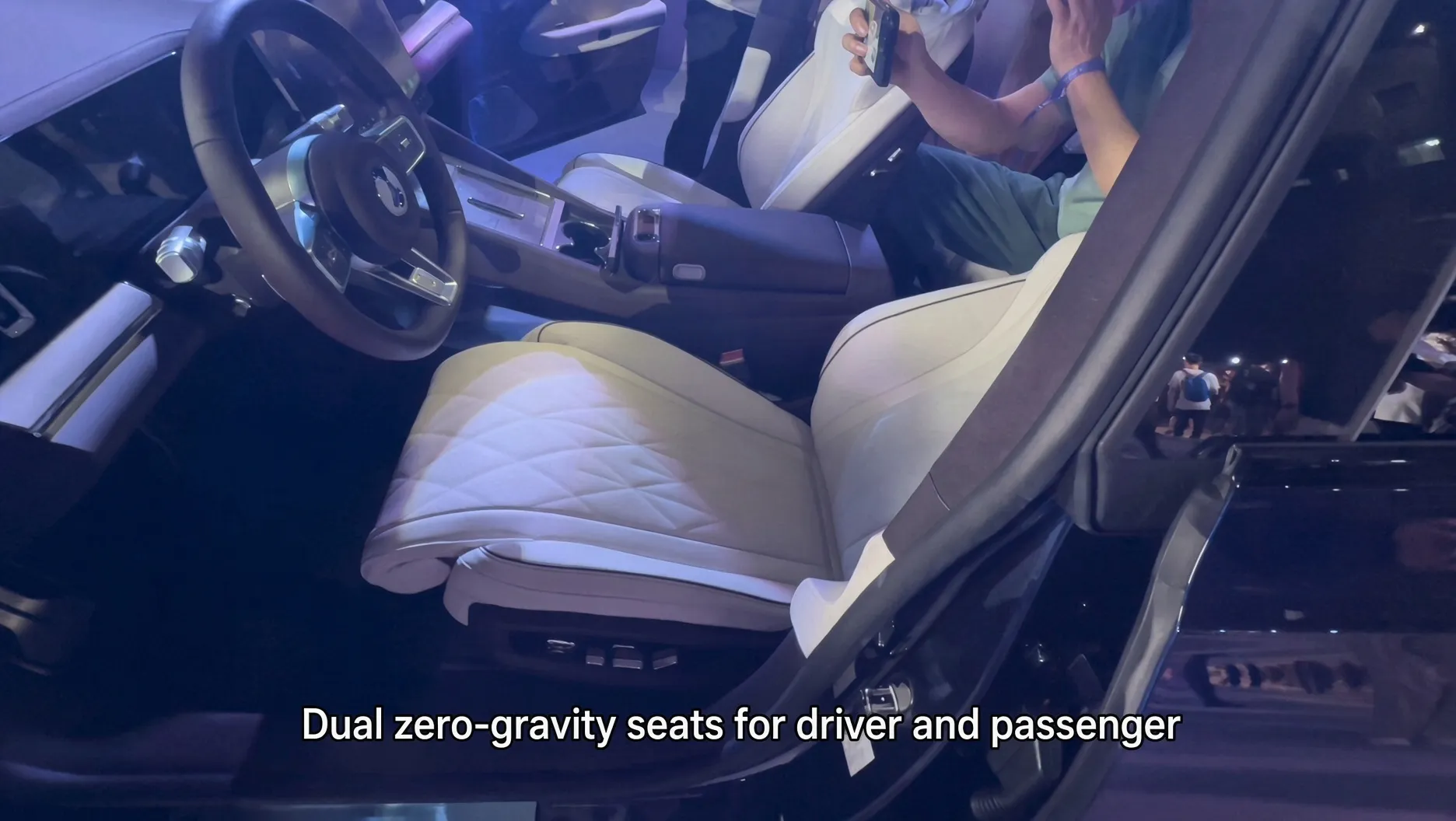 Denza Z9S front seat at the launch event with a visitor seated