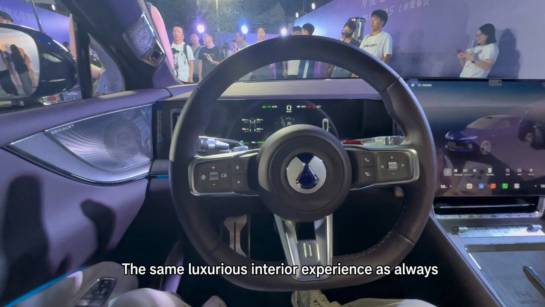 Denza Z9S interior at its launch event, seen through the open door with the crowd behind