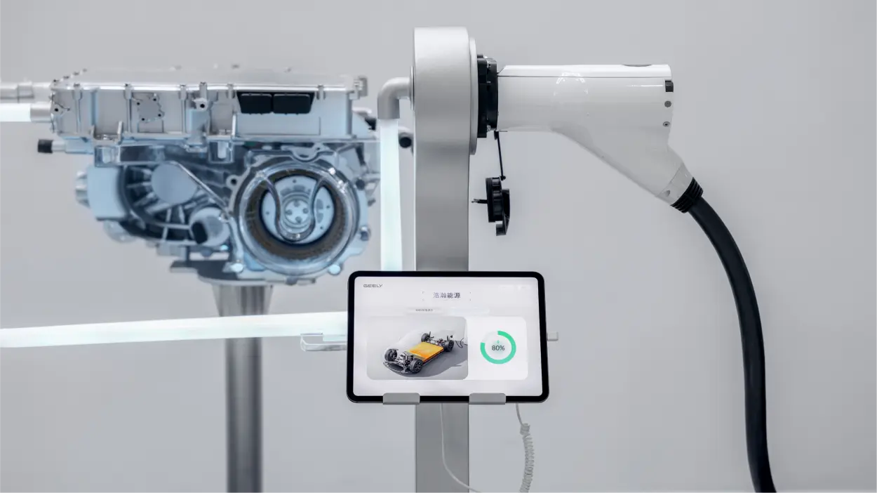 Geely Smart Charging booth display with a liquid-cooled connector and a screen showing battery state of charge