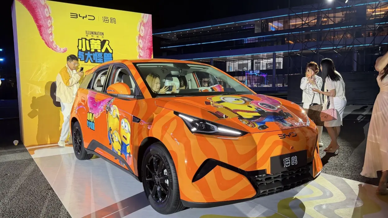 Visitors inspecting the orange show car on the opening evening